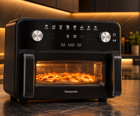 Panasonic Airfryer Test - Die Heissluftfriteuse steht in unserer Küche mit einer Pizza im Garkorb